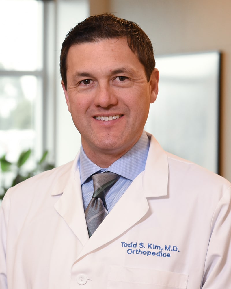 Tk headshot white coat
